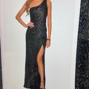 Dazzling sequin one shoulder gown.